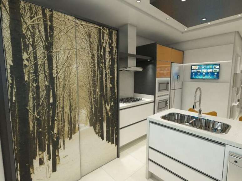 26. Cozinha com arm&aacute;rio com portas deslizantes e torneira gourmet. Projeto por Ednilson Hinckel