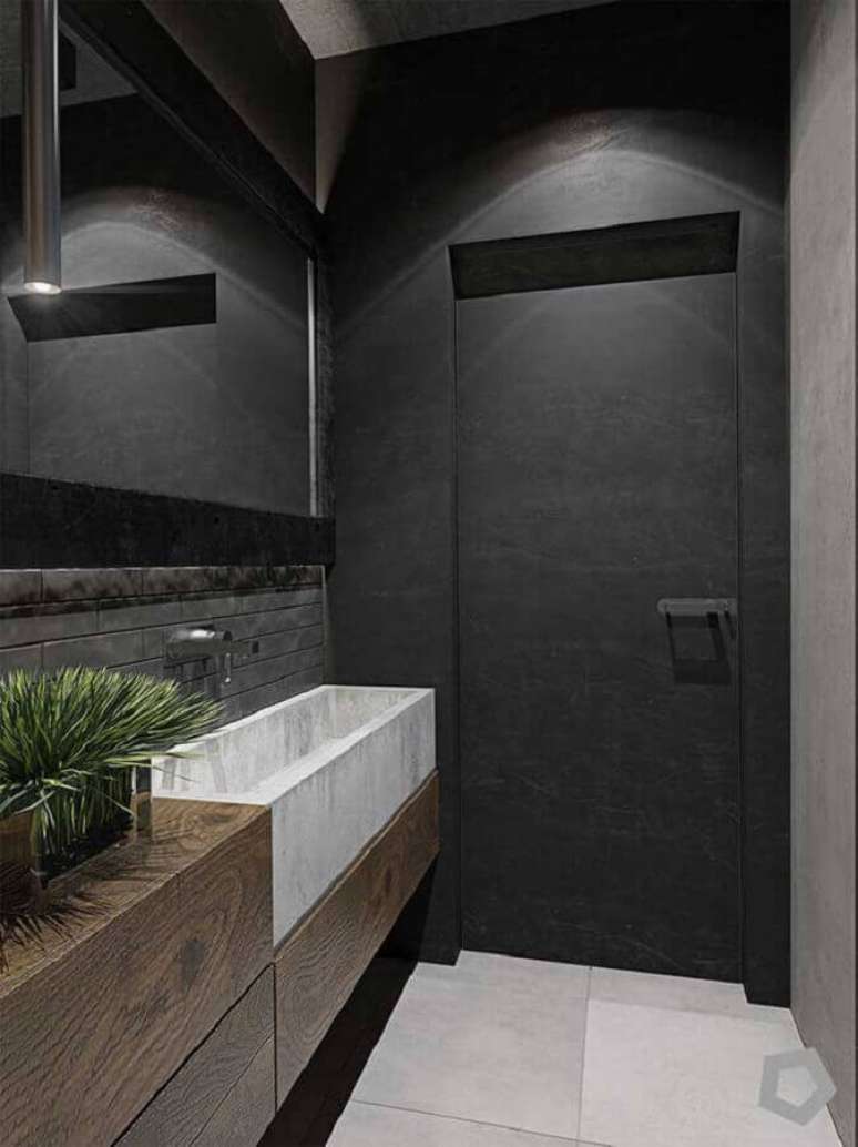 33. Banheiro com decoração industrial e bancada de madeira – Foto: Classicfi Reservices