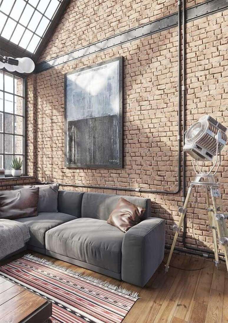 68. Decoração industrial para sala de estar com sofá de canto cinza e parede de tijolinho à vista – Foto: Arquiteto Versátil