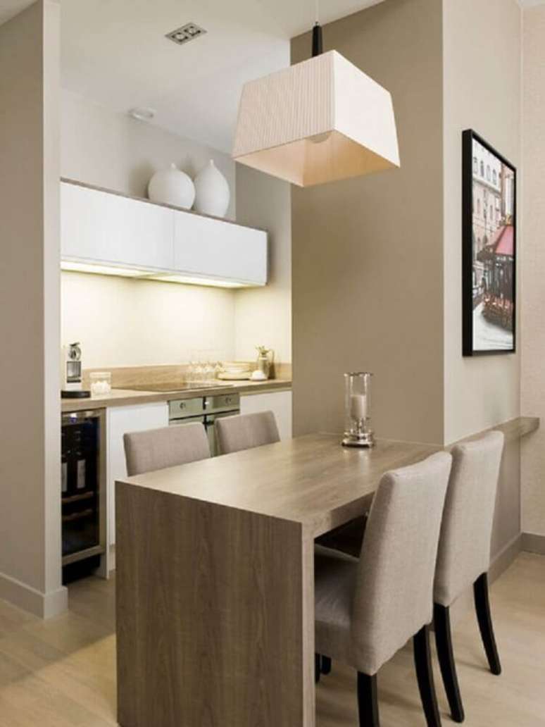 19. Alguns lustres simples brincam com os formatos das lumin&aacute;rias de mesa. Foto: Revista Viva Decora.