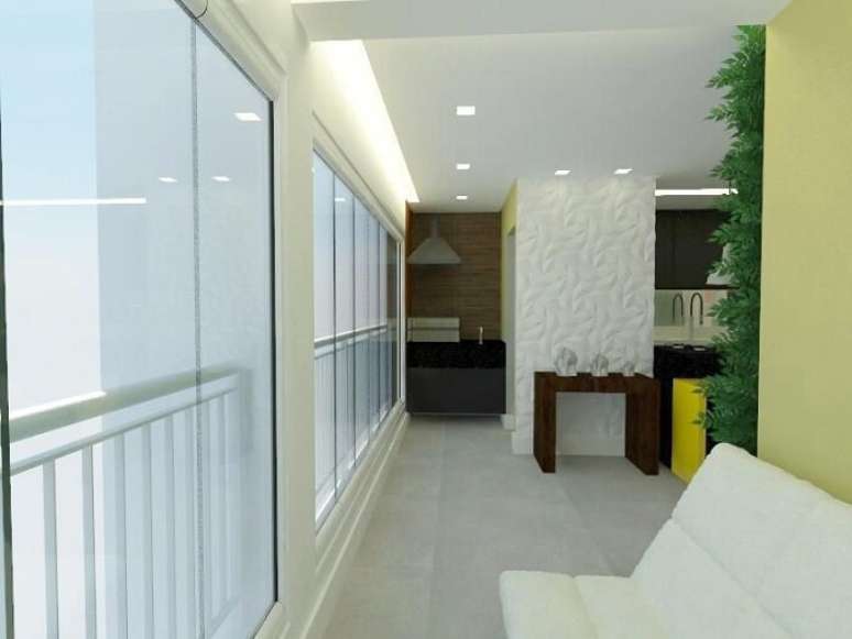 84. Varanda gourmet com parede revestida por placa de gesso 3D e ilumina&ccedil;&atilde;o pontual. Projeto por Filipe Saouda