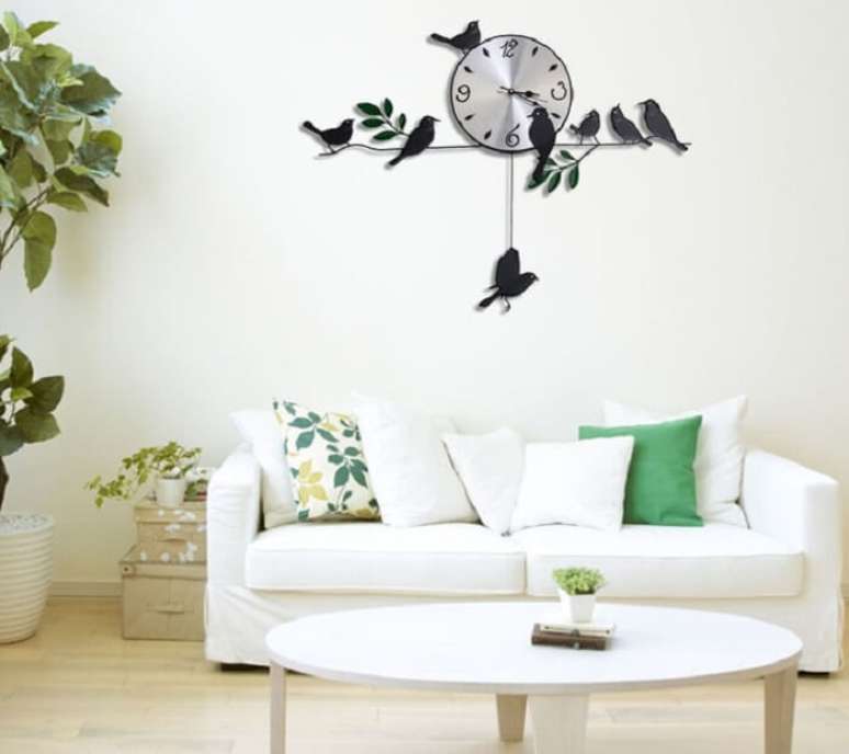 19. Relógio de parede feito de ferro com desenho de pássaros. Fonte: Pinterest