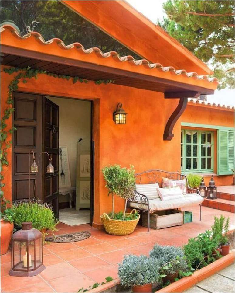 38. O laranjada usado como cores de tinta para casa fica lindo e bem descontraído para as cores de casas.