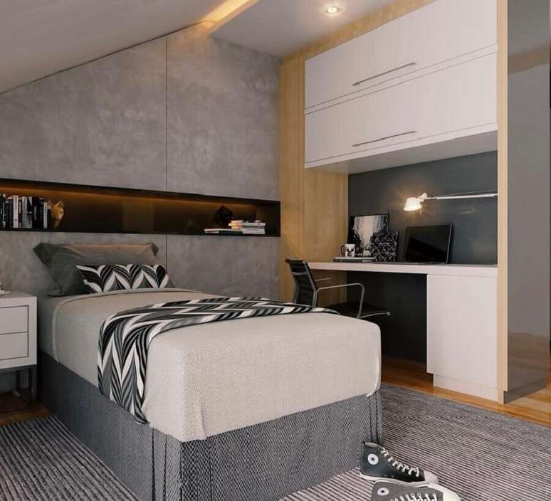 32. Decoração moderna com móveis planejados e cimento queimado para quarto com cama box baú solteiro – Foto: Pinosy