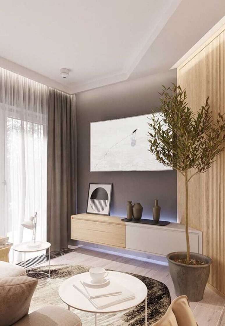 28. Rack de madeira moderno para decoração de sala pequena com parede cinza – Foto: Maurício Gebara Arquitetura
