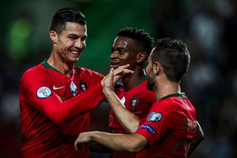 Cristiano Ronaldo e Bernardo Silva marcaram para Portugal (Foto: AFP)