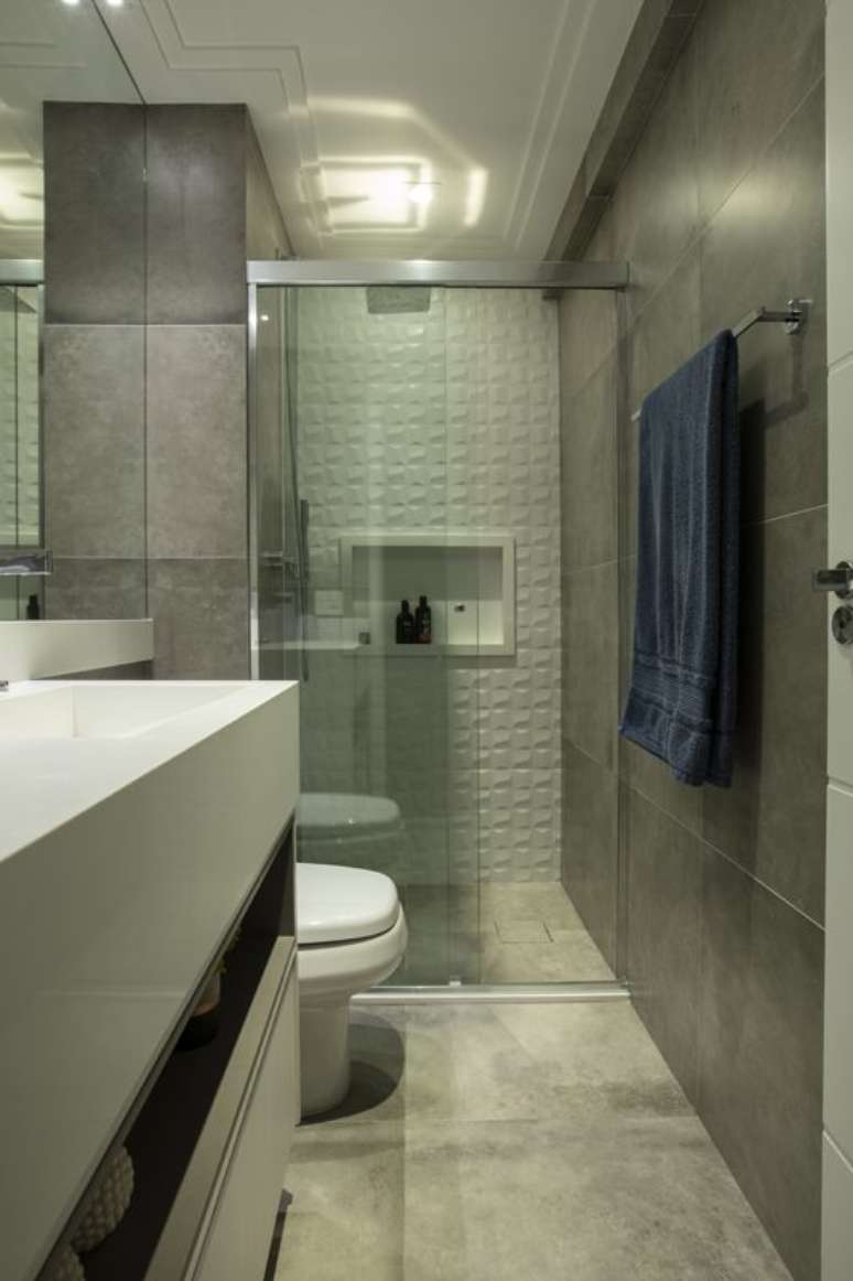 11. Banheiros também podem ter parede 3D. Projeto de LAM Arquitetura & Interiores