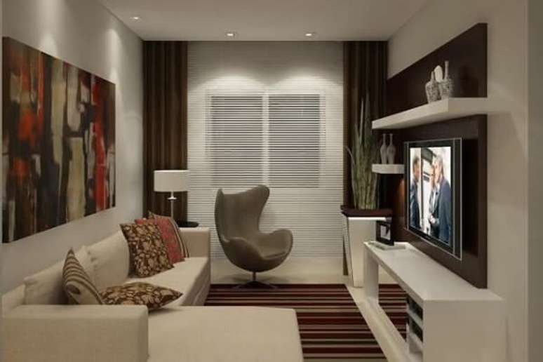 10. As poltronas para sala de tv podem ser posicionadas próxima a cortina do ambiente. Fonte: Pinterest