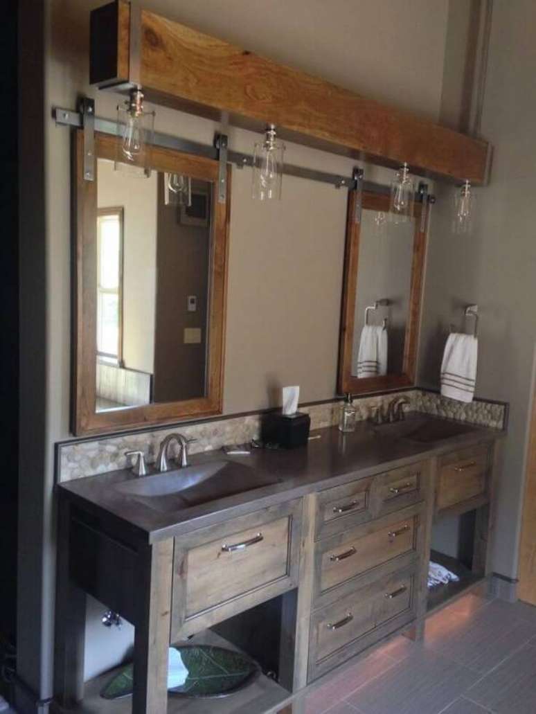 13. O armário de madeira para banheiro recebeu um acabamento especial com lampadas embutidas. Fonte: Home BNC