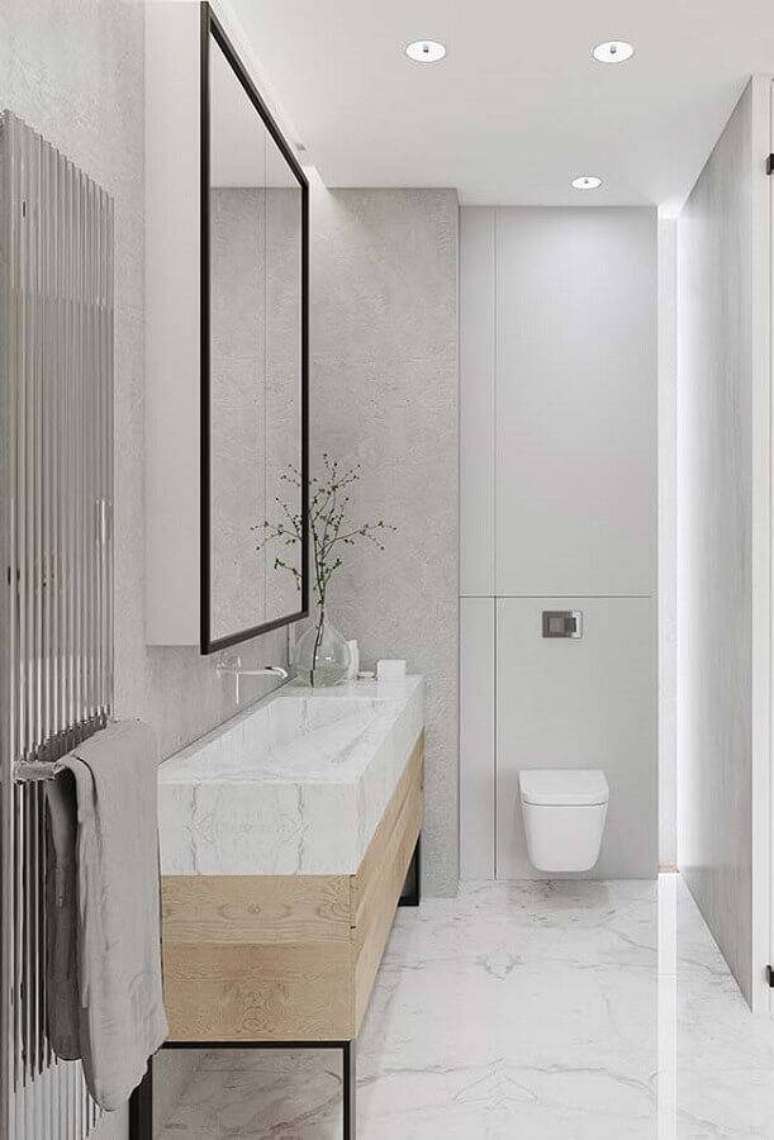 30. Decoração clean para banheiro pequeno moderno com bancada feita em mármore branco e madeira – Foto: Wood Save