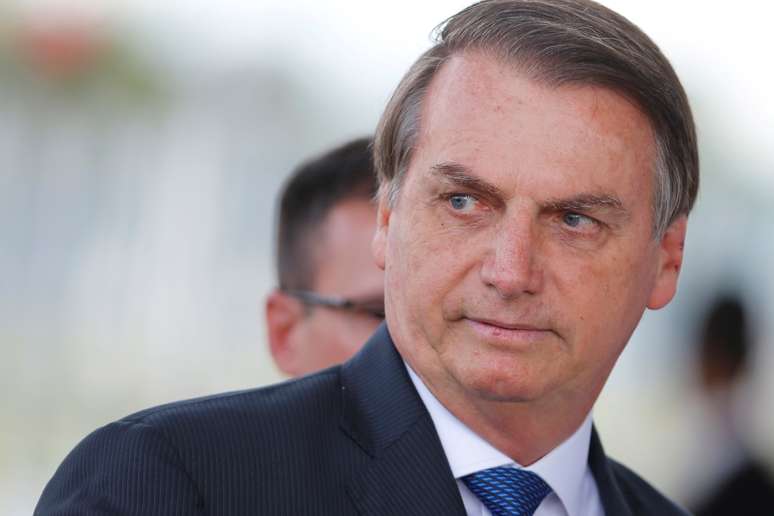 Brazil's President Jair Bolsonaro looks on as he leaves the Alvorada Palace in Brasilia, Brazil December 12, 2019. REUTERS/Adriano Machado