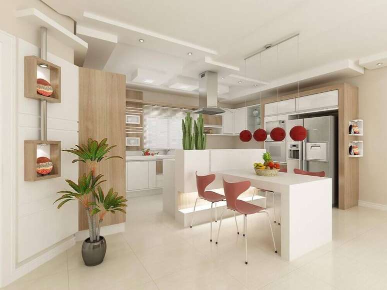 23. Cozinha decorada com nichos com lumin&aacute;ria para cozinha e lumin&aacute;rias vermelhas