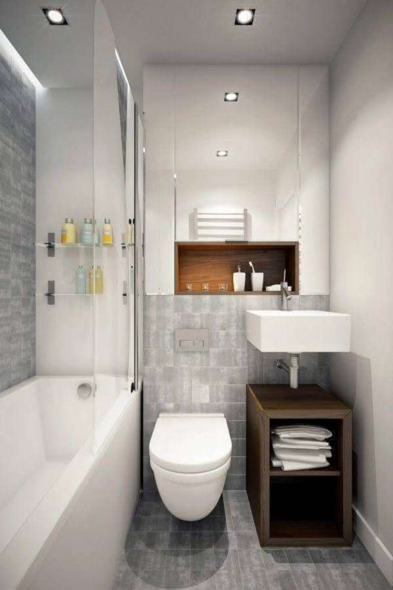 14. Decoração simples com gabinete pequeno para banheiro pequeno planejado branco e cinza – Foto: Divian Arts
