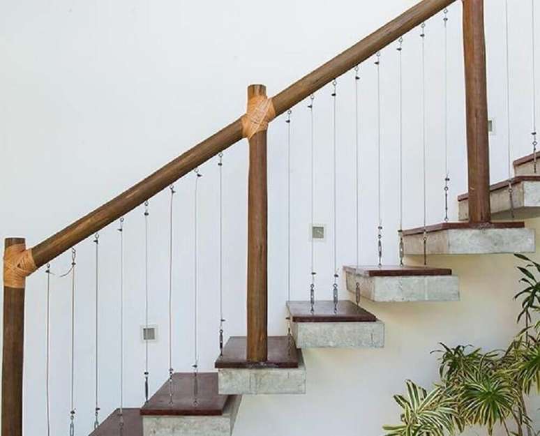 decora&ccedil;&atilde;o r&uacute;stica com corrim&atilde;o de madeira