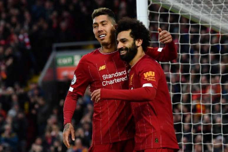 Ataque do Liverpool já marcou 61 gols no Campeonato Inglês (Foto: PAUL ELLIS / AFP)