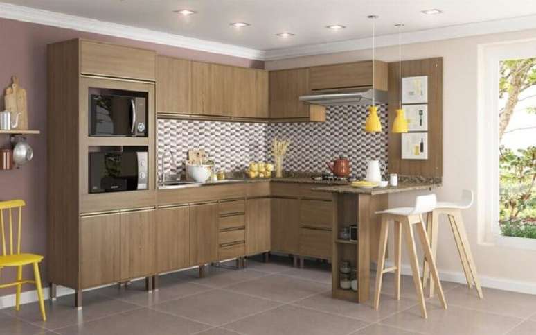 29. Arm&aacute;rio de cozinha modulado de canto todo feito em madeira &ndash; Foto: Webcomunica