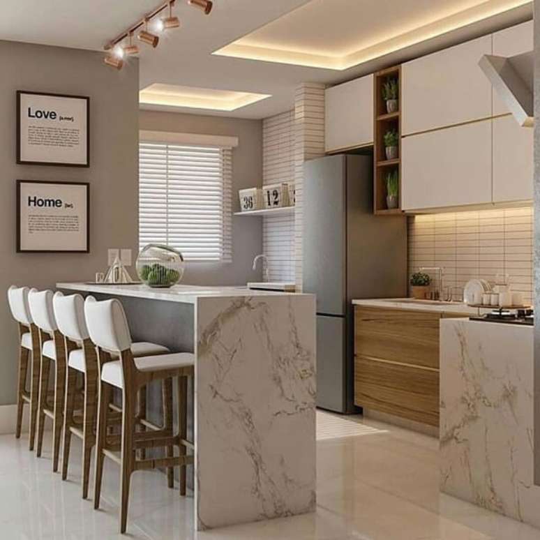 34. Banqueta para cozinha branca deixa o ambiente mais leve &ndash; Foto: Dicas decor