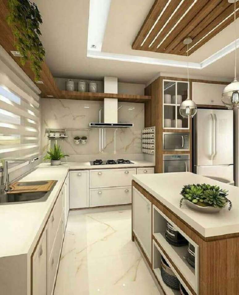 54. Cozinha planejada completa com ilha decorada com prateleiras e detalhes em madeira – Foto: Pinterest