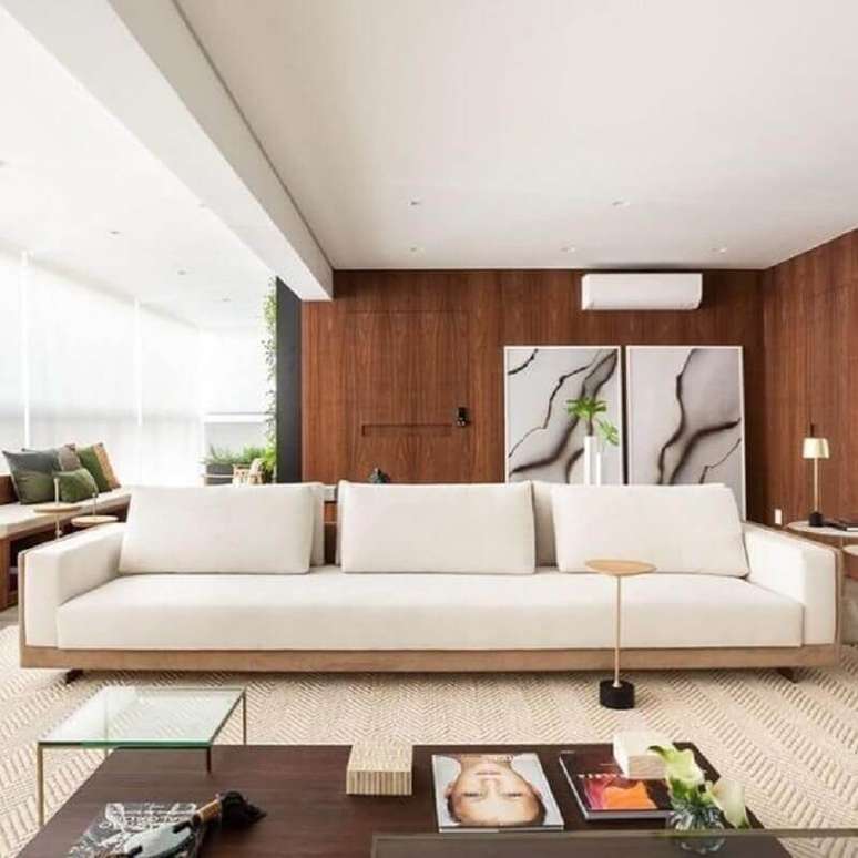 58. Sala com varanda integrada decorada com sofá moderno grande – Foto: Pinterest
