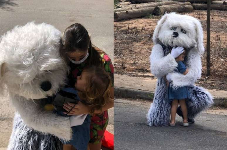 Lucas Fragoso, fantasiado de cachorro, abraça esposa e a filha