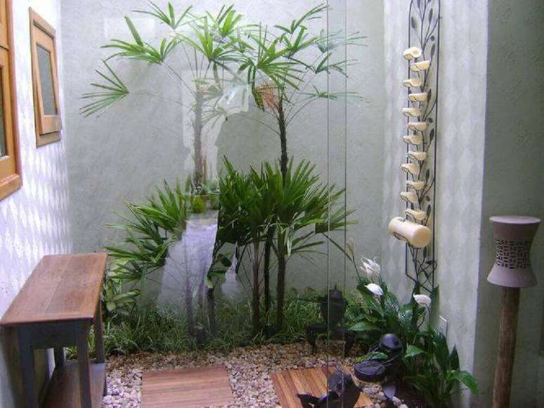 21. Sua sala pode ficar ainda mais charmosa com um modelo de jardim de inverno