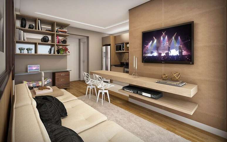 15. Sala planejada moderna com TV na parede – Foto: Apartment Therapy