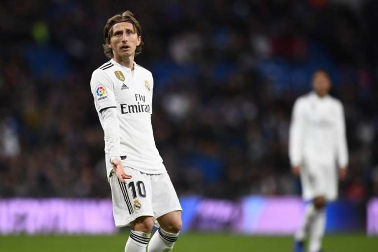 Apesar do desejo, Modric reconhece que poucos conseguem parar de jogar no Real Madrid (Foto: AFP)