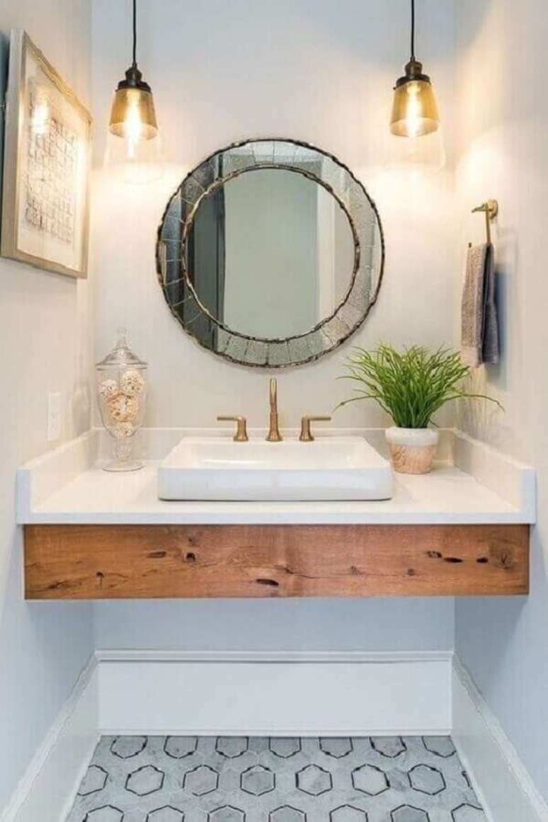 44. Decoração com espelho para banheiro redondo com acabamento bisote – Foto: Pinterest