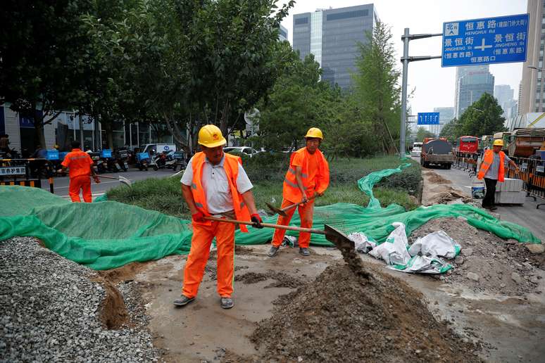 Trabalhadores em local de construção em Pequim. REUTERS/Thomas Peter