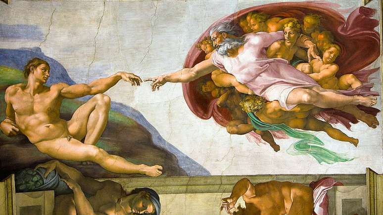 Pintura de Michelangelo na Capela Sistina; o tato &eacute; o primeiro sentido que desenvolvemos
