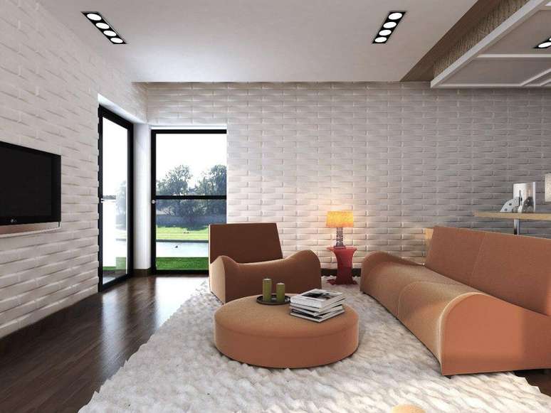 24. Revestimento 3D para sala branca com sofá rosa claro – Via: Revista VD