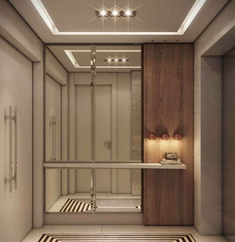 33. Decora&ccedil;&atilde;o de hall de entrada com parede espelhada &ndash; Foto: Home Fashion Trend