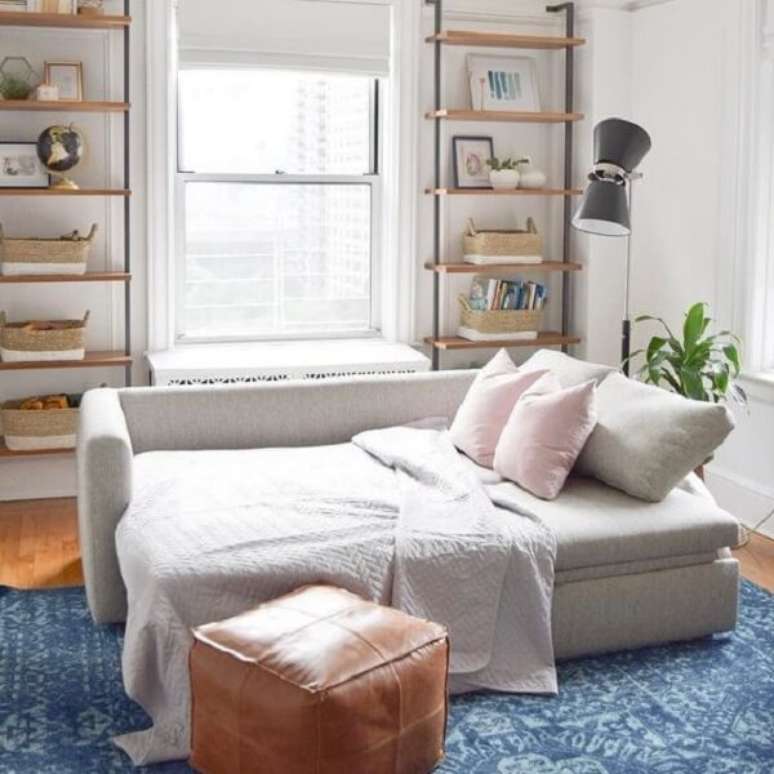 16. O sofá cama com baú otimiza o espaço no dormitório. Fonte: Pinterest