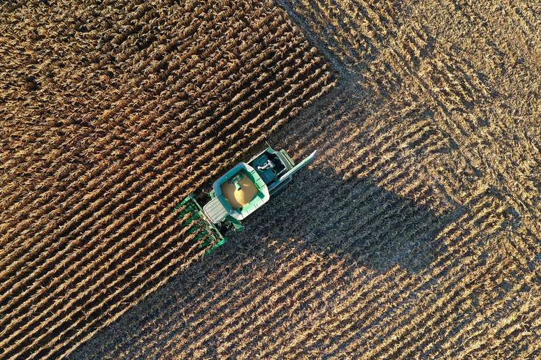 FILE PHOTO: Farmer Roger Hadley harvests corn from his fields in his John Deere combine in this aerial photograph taken over Woodburn, Indiana, U.S., October 16, 2020. REUTERS/Bing Guan/File Photo