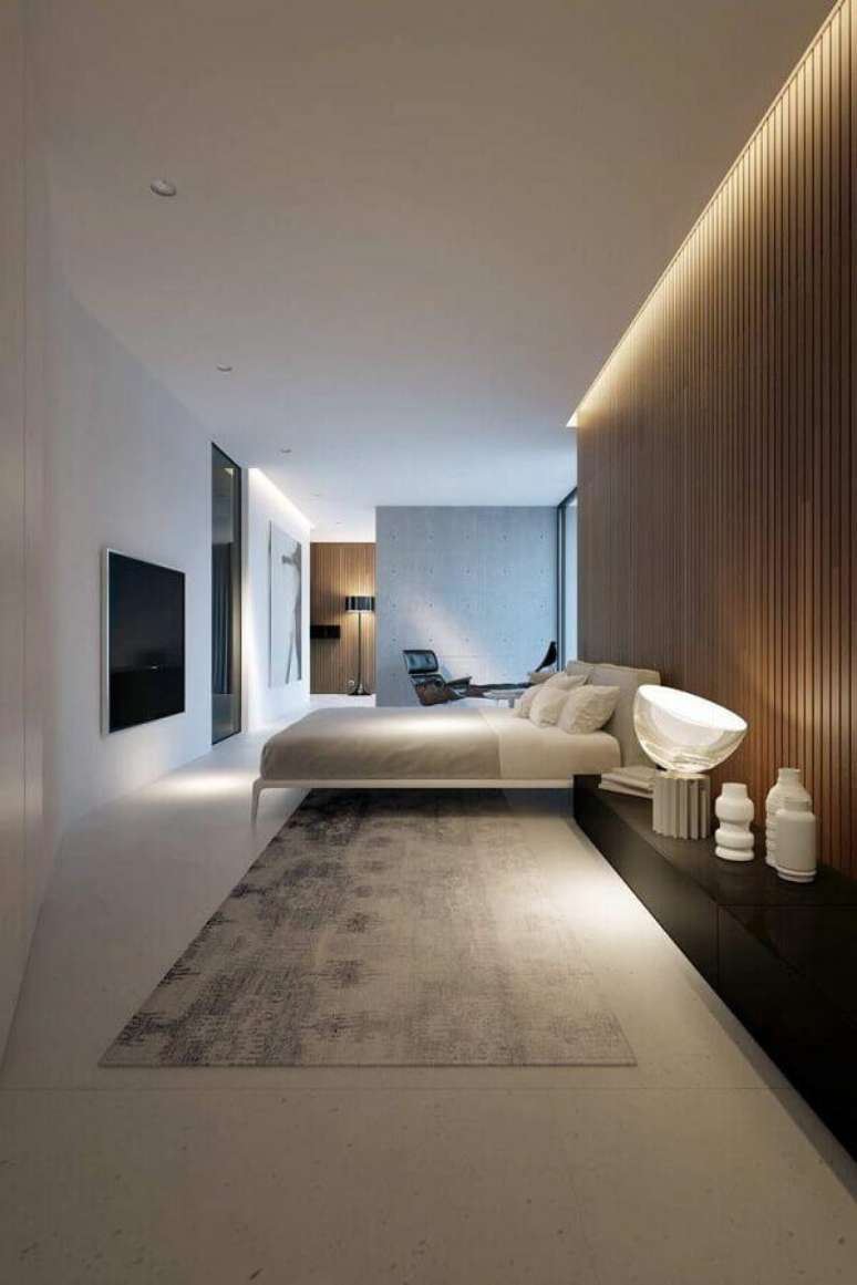 24. Parede de ripas de madeira para decoração de quarto de casal minimalista – Foto: Futurist Architecture