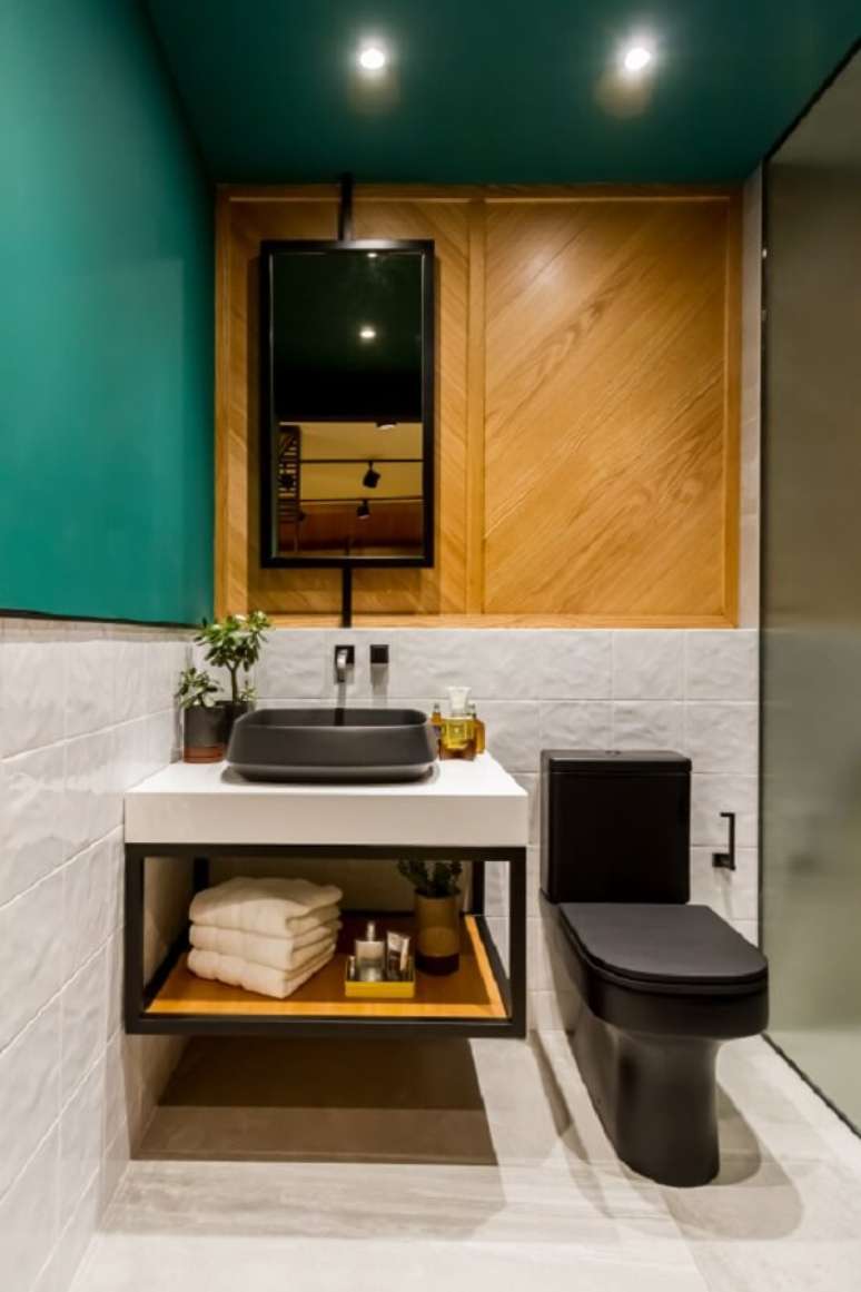 48. A cor da cuba de apoio para banheiro se assemelha ao tom do vaso sanit&aacute;rio. Fonte: Deca &ndash; Suite Masculina Lagom &ndash; Andrea R. Anez e Branda Jimenez