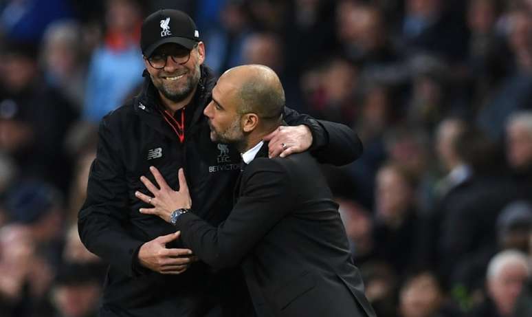 Klopp e Guardiola foram rivais na Alemanha antes de se reencontrarem na Inglaterra (Foto: PAUL ELLIS / AFP)