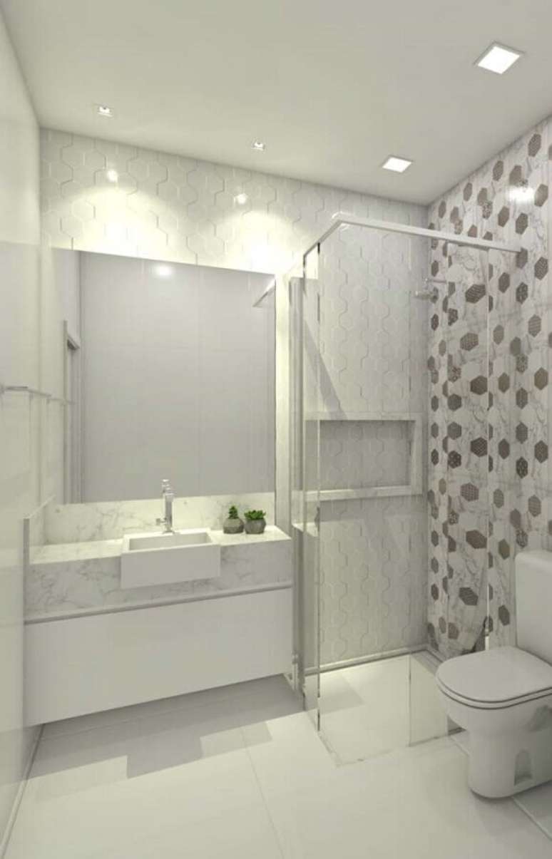 7. Bancada de mármore branco para banheiro decorado com revestimento geométrico – Foto Jeito de Casa