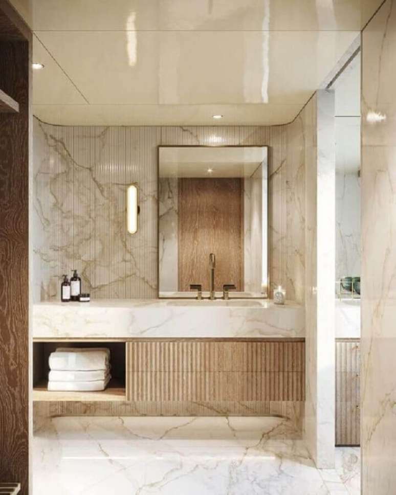 22. Bancada de mármore para banheiro sofisticado decorado em cores neutras – Foto Boca do Lobo