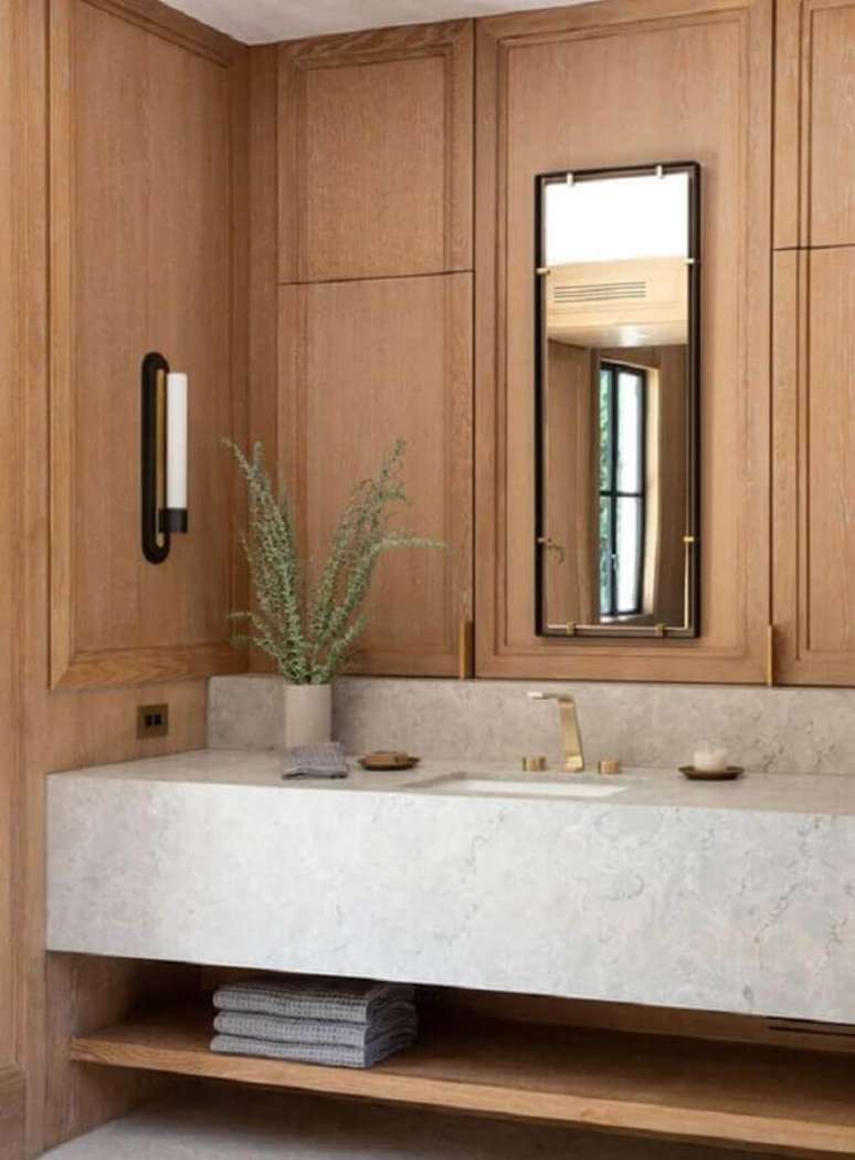 35. Decoração com bancada de mármore para banheiro amadeirado – Foto One Kindesign