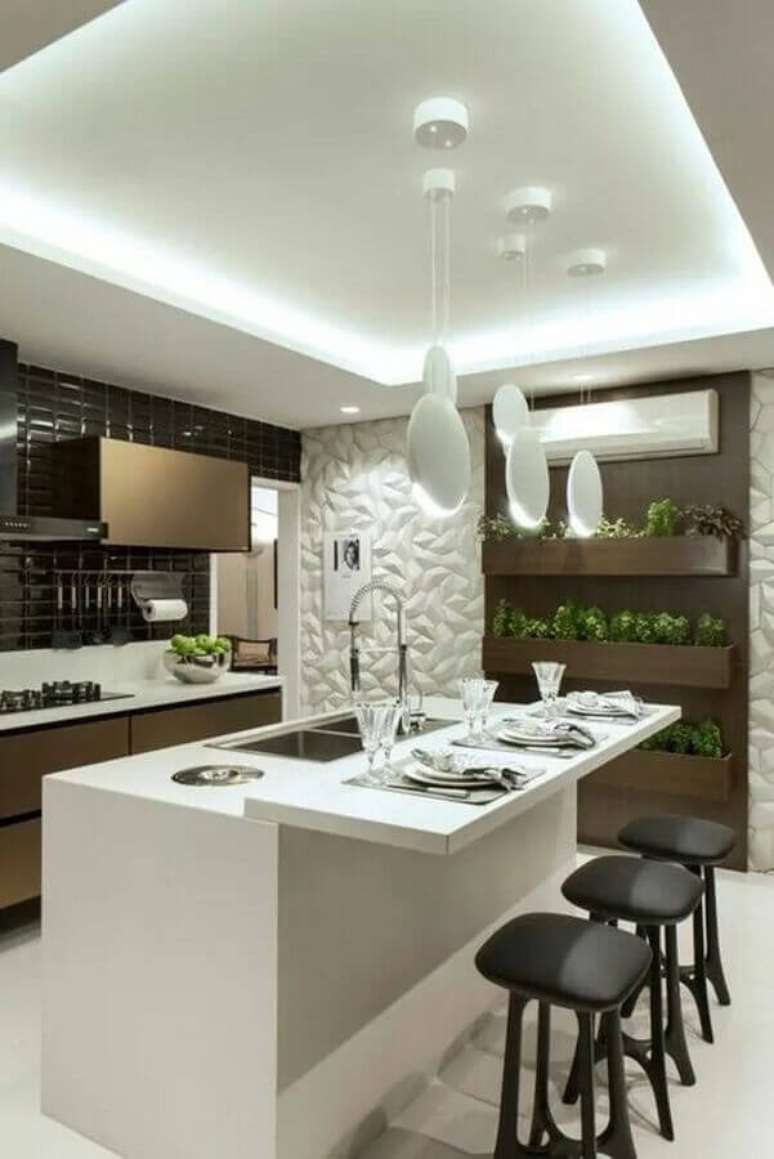 60. Revestimento 3D para decoração de cozinha com ilha gourmet pequena – Foto: Archzine