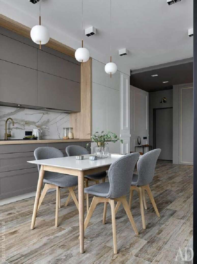 18. Cadeira estofada cinza para decoração de cozinha planejada moderna – Foto: Futurist Architecture