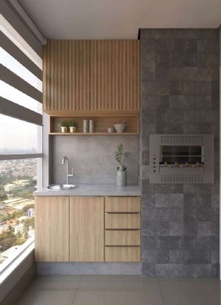 25. Decora&ccedil;&atilde;o de &aacute;rea gourmet com revestimento cinza para churrasqueira &ndash; Foto: Archtrends