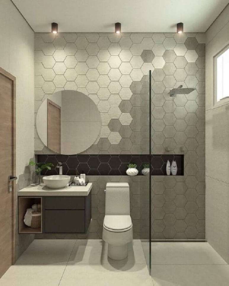 27. Decoração de banheiro moderno com revestimento hexagonal cinza em várias tonalidades – Foto: Arkpad