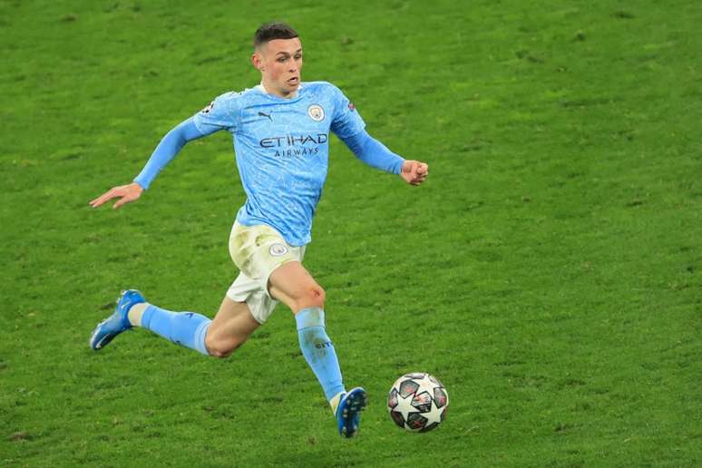 Phil Foden marcou o gol da virada sobre o Borussia Dortmund na Champions (Foto: WOLFGANG RATTAY / AFP / POOL)