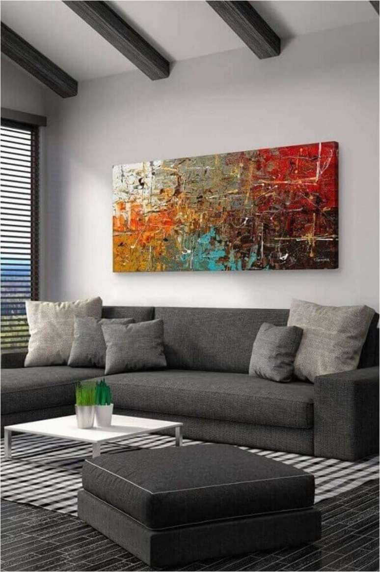 62. Decoração com quadro grande para sala de estar com sofá de canto cinza – Foto: Pinterest