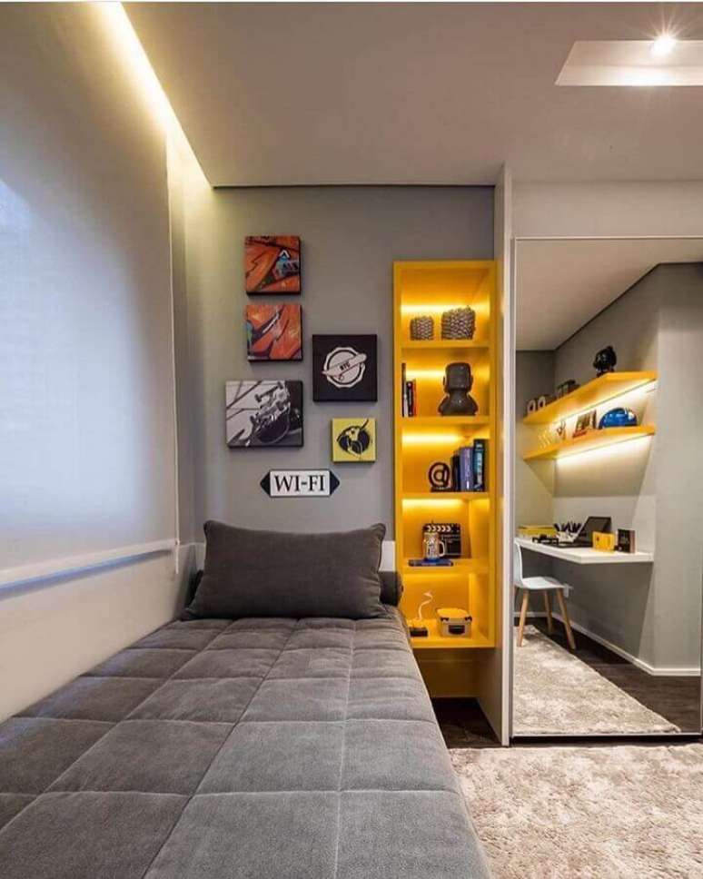 59. Tons de cinza para decoração de quarto de homem solteiro com nichos amarelos – Foto: Pinterest