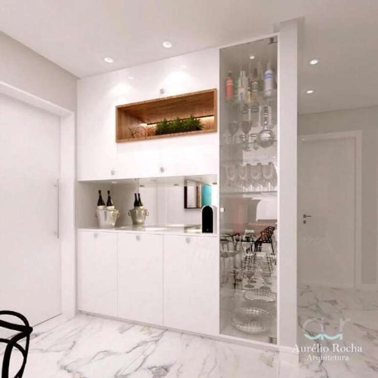 36. Buffet e cristaleira branca como divis&oacute;ria de ambientes. Fonte: Aur&eacute;lia Rocha