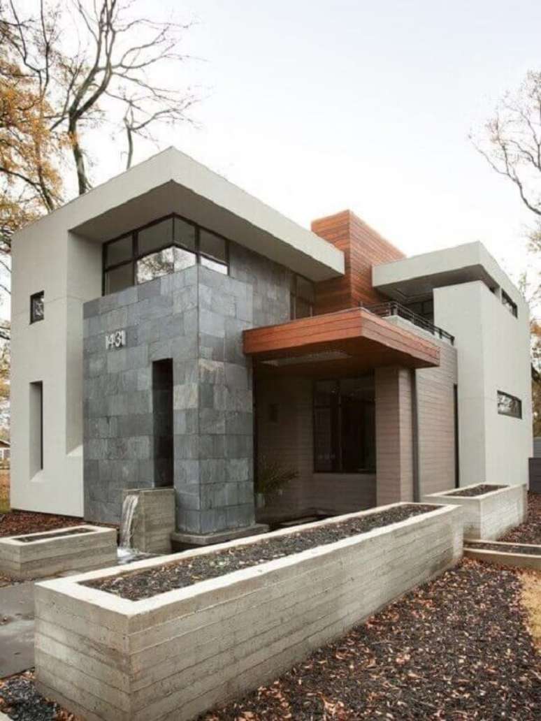 62. Para uma decora&ccedil;&atilde;o mais sofisticada aposte na pedra ard&oacute;sia como revestimento externo. Fonte: Pinterest