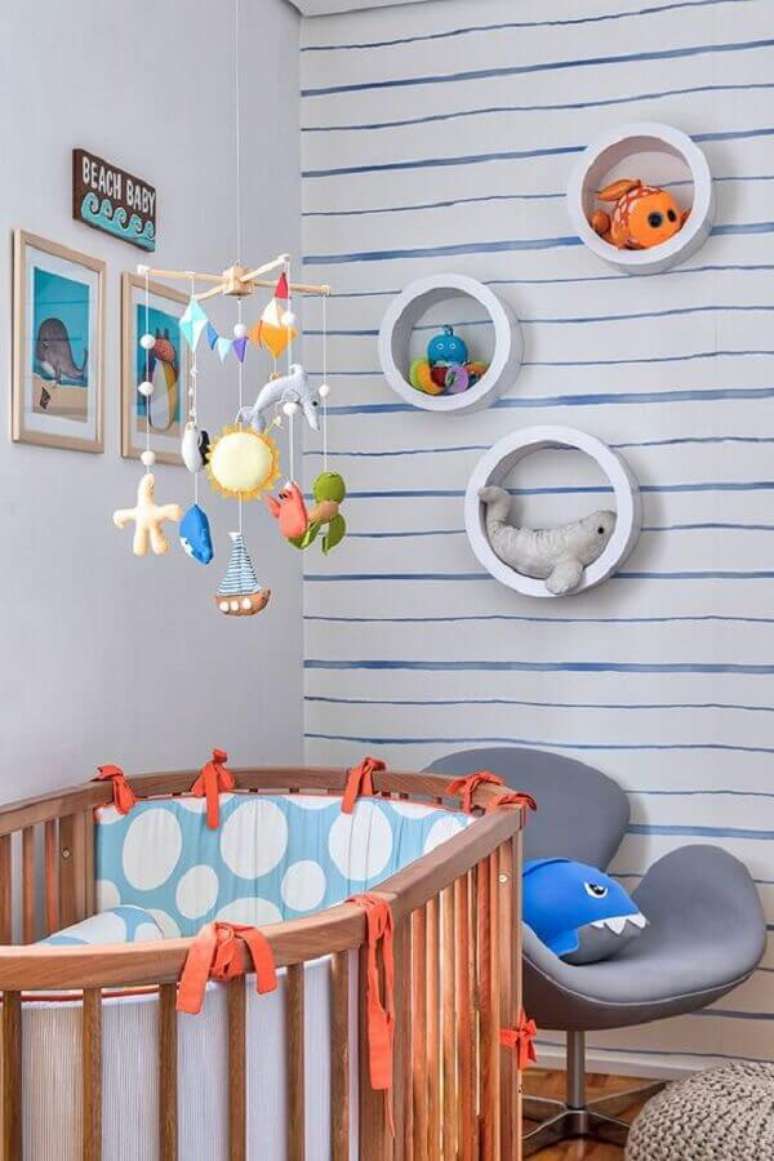 43. Nicho redondo para quarto de bebê decorado com tema fundo do mar – Foto: Doob Arquitetura